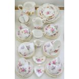 A ROYAL CROWN DERBY POSIES PATTERN TEA SERVICE TO INCLUDE FOUR VARIOUS JUGS AND TWO HEART,