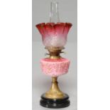 A VICTORIAN MOULDED GLASS OIL LAMP, C1890, THE SHADED PINK GLASS FOUNT WITH BUTTERFLIES AND LEAVES