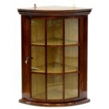 A MAHOGANY BOW FRONTED CORNER CABINET, 66CM H; 51 X 35CM Condition report  Some drips of paint to