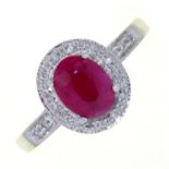 A RUBY AND DIAMOND CLUSTER RING, IN WHITE GOLD WITH PIERCED SHOULDERS, MARKED 14K, 4.1G, SIZE M