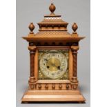 A GERMAN WALNUT MANTEL CLOCK, THE LACQUERED BRASS DIAL WITH SILVERED CHAPTER RING AND H.A.C.