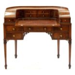 A MAHOGANY CARLTON HOUSE WRITING TABLE, C1930, WITH GILT TOOLED LEATHER INLET TOP, THE