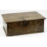A BOARDED OAK BOX,  LATE 17TH C, THE CHIP CARVED LID WITH IRON HASP AND INCISED WITH THE INITIALS