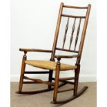 AN EARLY VICTORIAN ASH SPINDLE BACK ROCKING CHAIR, C1840, RUSH SEATED, 69CM H Condition report