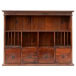A STAINED WOOD WALL HANGING CHEST, WITH AN ARRANGEMENT OF SHELVES, PIGEON HOLES AND DRAWERS WITH