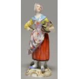 A MEISSEN FIGURE OF A YOUNG GRAPE HARVESTER, 20TH C, STANDING ON SCROLLING GILT MOUND, 12.5CM H,