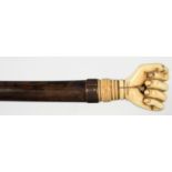 A HARDWOOD WALKING CANE WITH VICTORIAN CARVED BONE CLENCHED FIST POMMEL, 81CM Condition report  Fist