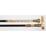TWO VICTORIAN MOTHER OF PEARL AND GILTMETAL PARASOL HANDLES ON LATER ASSOCIATED EBONY OR OTHER
