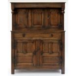 A 17TH C STYLE OAK LIVERY CUPBOARD, 20TH C, WITH BULBOUS PENDANTS AND IRON BUTTERFLY OR SERPENT