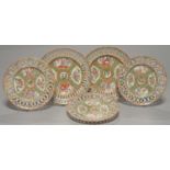 A PAIR AND SET OF THREE CANTON FAMILLE ROSE PLATES WITH PIERCED BORDER, 19TH C, 21.5CM AND 24.5CM