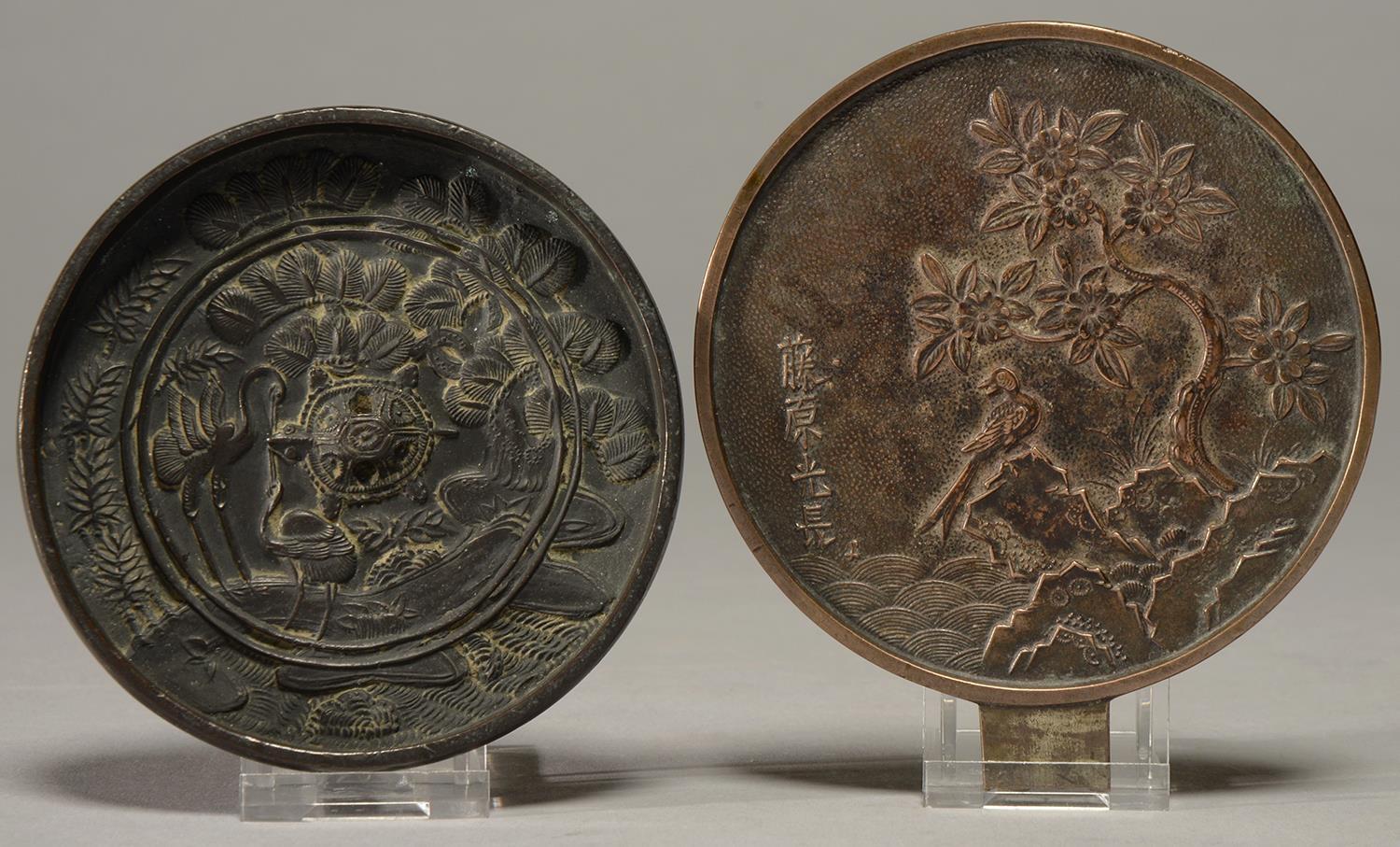 A JAPANESE BRONZE MIRROR, LATE EDO EARLY MEIJI PERIOD, CAST WITH A BIRD ON A ROCK, BLOSSOMING TREE