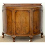 A SEMI ELLIPTICAL WALNUT COMMODE, C1930, IN GEORGE III STYLE, WITH BUTTERFLY VENEERED TOP AND