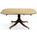 A VICTORIAN MAHOGANY BREAKFAST TABLE, ON BALUSTER PILLAR AND QUADRUPLE REEDED LEGS WITH BRASS