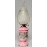 A VICTORIAN GLASS OIL LAMP C1890, OF OPAL GLASS CASED IN BLANMANGE PINK AND PAINTED WITH LILLIES,