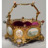 A PALAIS ROYAL PIERCED AND ENGRAVED GILT BRASS WORK BASKET, MOUNTED WITH HARDSTONES AND INSET WITH