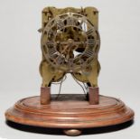 A VICTORIAN BRASS TWIN FUSEE SKELETON CLOCK, ON OVAL MAHOGANY BASE, 27CM H OVERALL Condition report