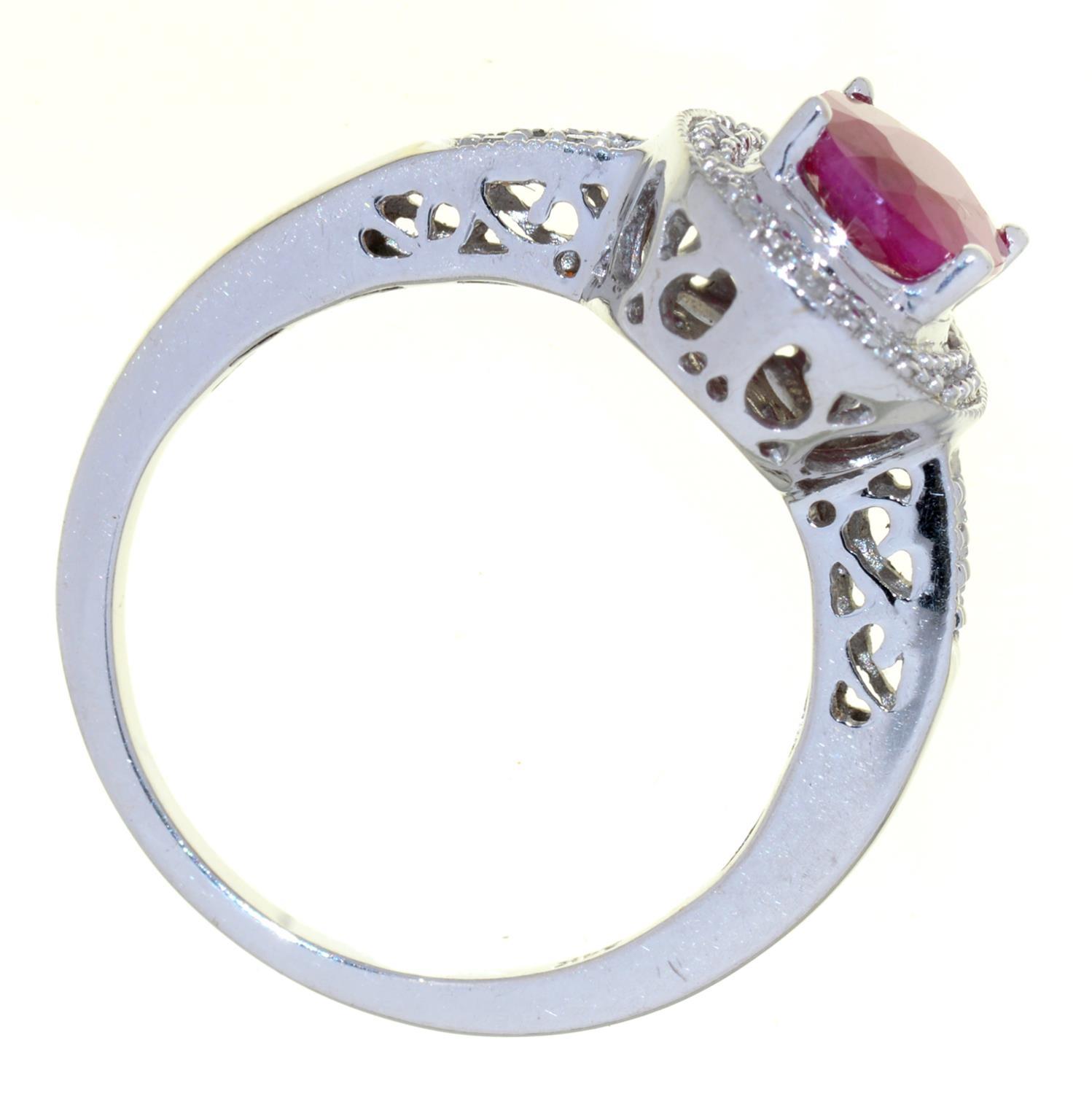 A RUBY AND DIAMOND CLUSTER RING, IN WHITE GOLD WITH PIERCED SHOULDERS, MARKED 14K, 4.1G, SIZE M - Image 2 of 2