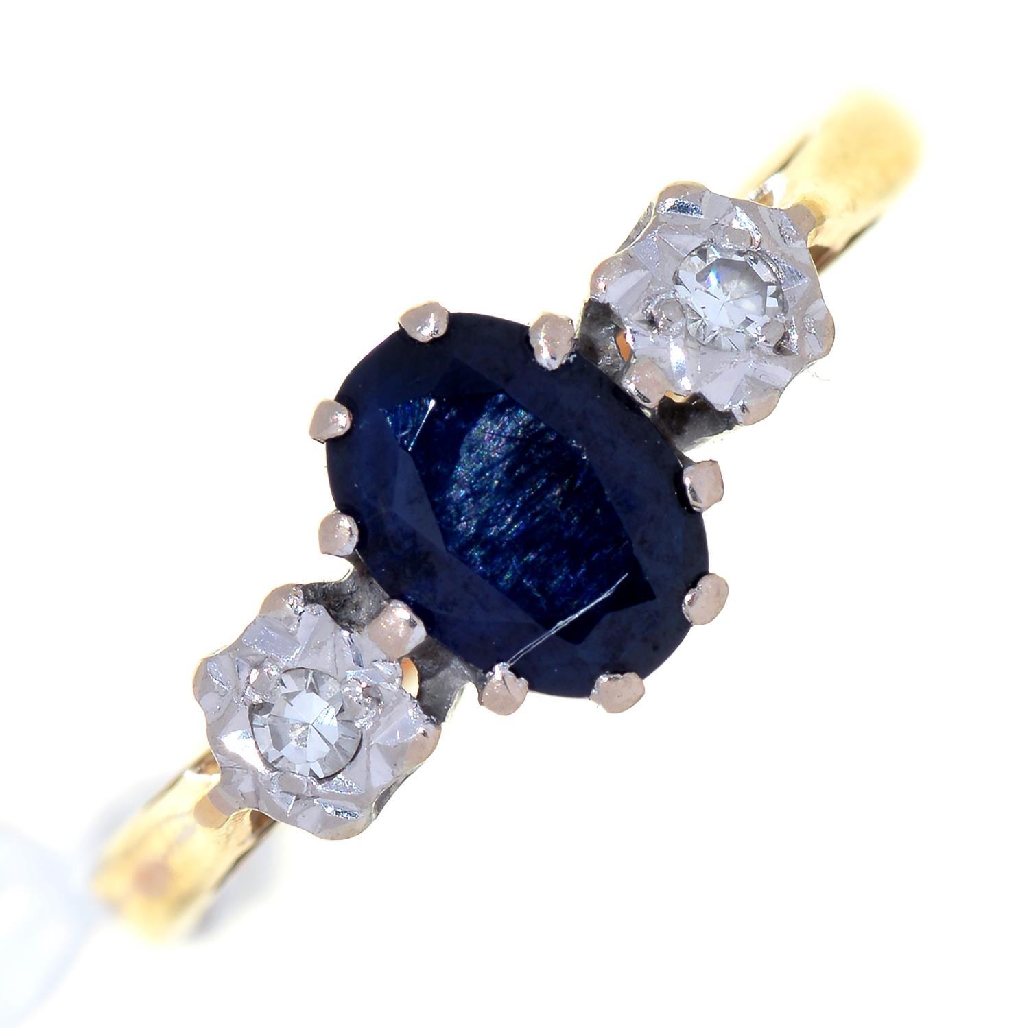 A SAPPHIRE AND DIAMOND THREE STONE RING, THE DIAMONDS ILLUSION SET IN 18CT GOLD, BIRMINGHAM 1969,