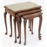 A CARVED WALNUT NEST OF TABLES, 59CM H; 59 W X 42CM Condition report  Largest table surface