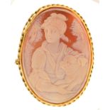 A CAMEO BROOCH, CARVED WITH A LADY AND DOG, MOUNTED IN GOLD, 62MM, UNMARKED Condition report