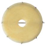 A CHINESE JADE BI DISC MOUNTED AS A BROOCH Condition report