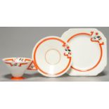 AN ART DECO SHELLEY BONE CHINA 'J' PATTERN TEACUP, SAUCER AND PLATE OF VOGUE SHAPE, C1930, PRINTED