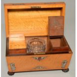 AN EARLY VICTORIAN MAPLE TEA CHEST, C1840, OF SARCOPHAGUS SHAPE, INLAID IN ROSEWOOD AND CUT MOTHER