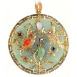 A SOUTH EAST ASIAN GEM SET GOLD AND JADE PENDANT, THE FRONT DECORATED WITH BIRDS IN BRANCHES, THE