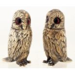 A PAIR OF VICTORIAN EPNS OWL NOVELTY PEPPER CASTERS AND COVERS, LATE 19TH C, WITH GLASS EYES, 10CM H
