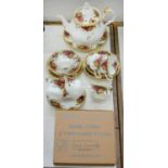 A ROYAL ALBERT OLD COUNTRY ROSES PATTERN TEA SERVICE, TO INCLUDE A TWO TIER CAKE STAND, BOXED,