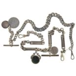TWO SILVER ALBERTS, C.1900 WITH T-BAR, HARDSTONE SWIVEL AND TWO COINS, 36 AND 38CM OVERALL, LINKS OF