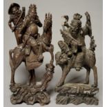 TWO CHINESE CARVED HARDWOOD SCULPTURES OF MOUNTED IMMORTALS, LATE 19TH C, ONE WITH AN ATTENDANT,