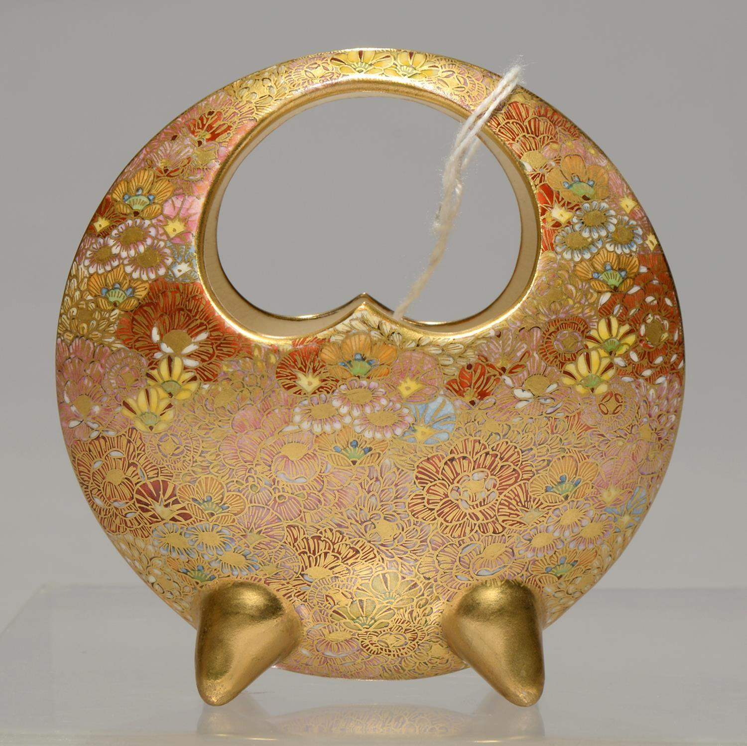 A JAPANESE SATSUMA MOON BASKET, MEIJI PERIOD, WITH MILLEFLEURS DECORATION, ON FOUR POINTED GILT