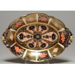 A ROYAL CROWN DERBY OVAL IMARI PATTERN DESSERT DISH WITH PIERCED ACORN HANDLES AND FEET, 29CM L,