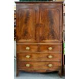 A VICTORIAN MAHOGANY LINEN PRESS, THE UPPER PART WITH PANELLED DOORS, DIVIDED INTO TWO SECTIONS,