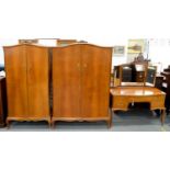 AN INLAID WALNUT THREE PIECE BEDROOM SUITE BY MAPLE & CO, C1950, COMPRISING SERPENTINE MIRROR BACKED