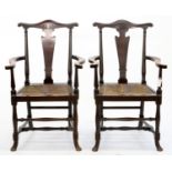 A PAIR OF VICTORIAN OAK RUSH SEATED ELBOW CHAIRS, SEAT HEIGHT 48CM, 64CM W One arm detached,