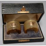 A PAIR OF SCOTTISH EDWARDIAN HORN NAPKIN RINGS, APPLIED WITH GOLD SHIELD FLANKED BY THISTLES, C1910,