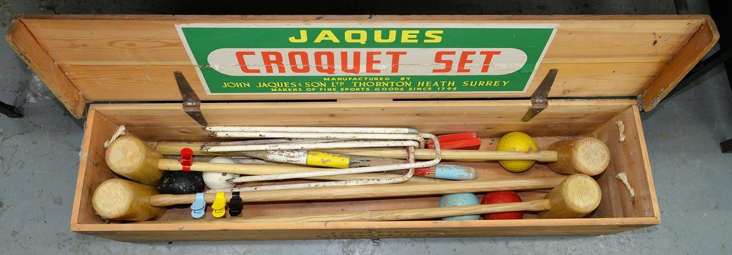 A JOHN JACQUES AND SON LIMITED CROQUET SET, COMPRISING FOUR MALLETS, SIX WHITE PAINTED IRONS, HOOPS,