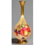 A ROYAL WORCESTER VASE, 1958, PAINTED BY FREEMAN, SIGNED, WITH FRUIT, THE FLARED NECK AND FOOT GILT,