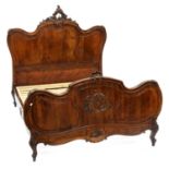 A FRENCH CARVED AND PANELLED WALNUT BED, LATE 19TH C, 136CM W, HEADBOARD 152CM H Very minor scuffs