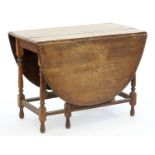 A VICTORIAN OAK GATELEG TABLE, 75CM H; 106 X 168CM Top split and heavily faded, otherwise good,