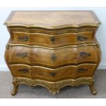 A CONTINENTAL PARCEL GILT WALNUT BOMBE COMMODE, 20TH C, IN LOUIS XV STYLE, THE CROSSBANDED TOP IN