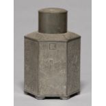 A CHINESE HEXAGONAL PEWTER TEA CADDY AND COVER, LATE 19TH C, THE SIDES ENGRAVED WITH FIGURES
