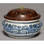 A CHINESE BLUE AND WHITE CENSER,  LATE QING DYNASTY OR LATER, WITH VESTIGIAL MASK HANDLES, WOOD