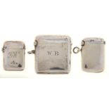 THREE VICTORIAN, EDWARDIAN AND GEORGE V SILVER VESTA CASES, PLAIN BUT FOR ENGRAVED INITIALS, 36-49MM