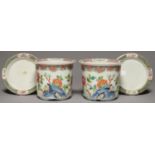 A PAIR OF CHINESE FAMILLE ROSE CACHE POTS AND STANDS, WITH EVERTED RIM AND AND PANELLED DIAPER