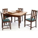 AN EDWARDIAN OAK EXTENDING DINING TABLE ON TURNED LEGS WIT ONE LEAF AND A SET OF FOUR OAK DINING