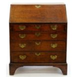 A GEORGE III OAK BUREAU ON BRACKET FEET, 104CM H; 86 X 46CM Side panel split, top surface marked,