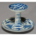 A CHINESE BLUE AND WHITE STAND, PAINTED WITH PHOENIX AND LINGZHI, THE UNDERSIDE WITH SHOU